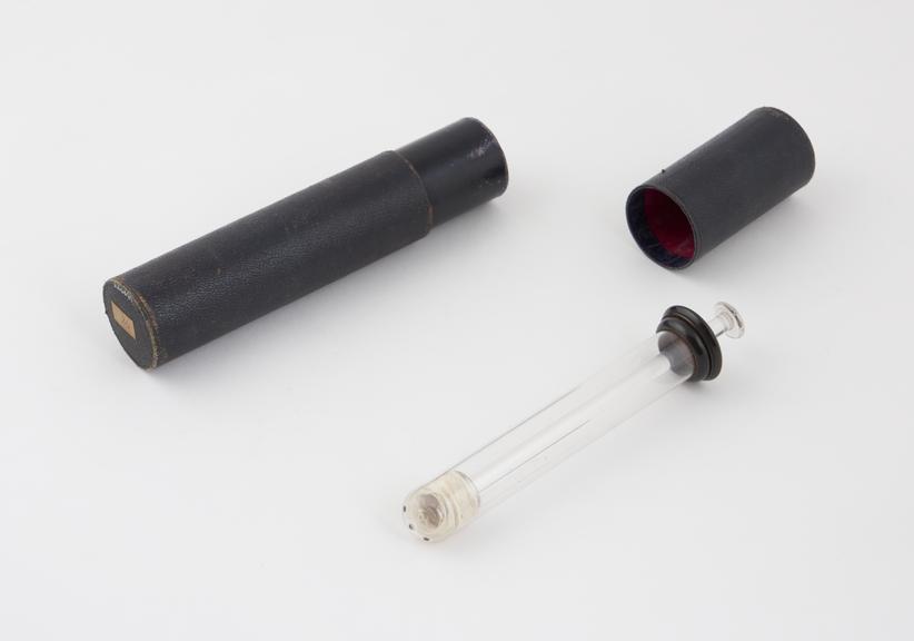 Glass vaginal syringe, in case, piston action