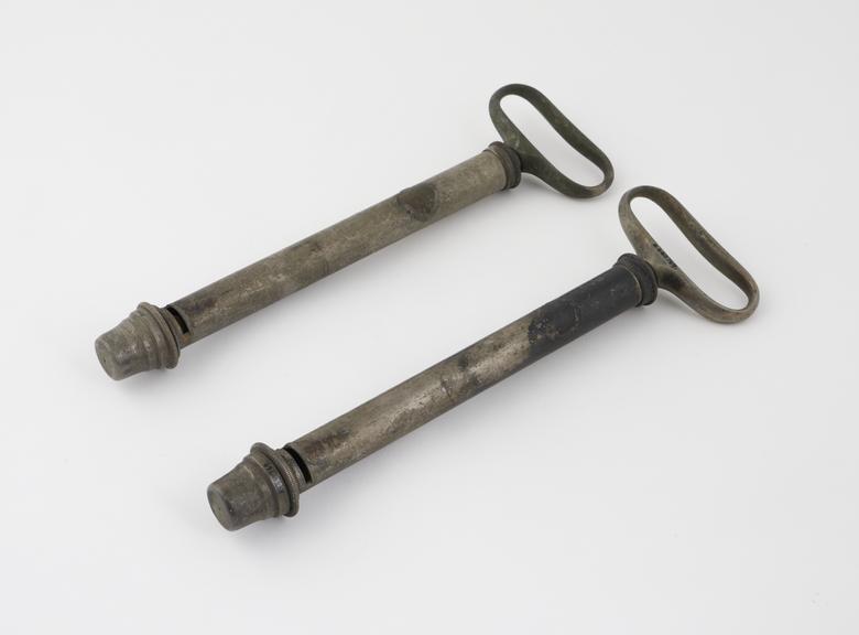 Two silvered brass vaginal syringes, both fitted with strainer