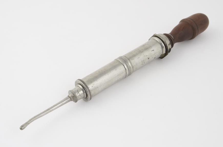 Pewter enema syringe with wooden handle and piston rod