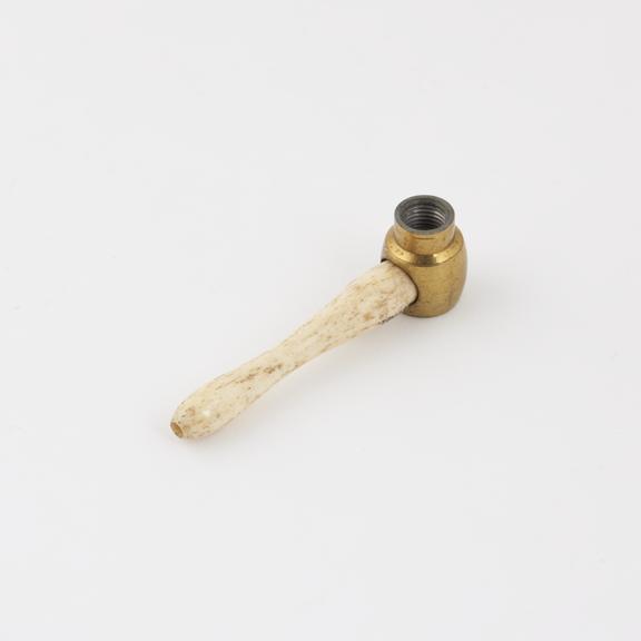 Bone nozzle and brass joint from an enema syringe