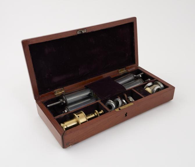 Brass artificial leech in wooden case, with accessories