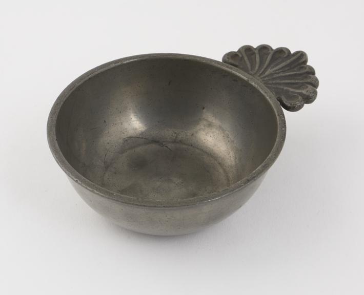 Pewter bleeding bowl, scallop shell, designed handle, English