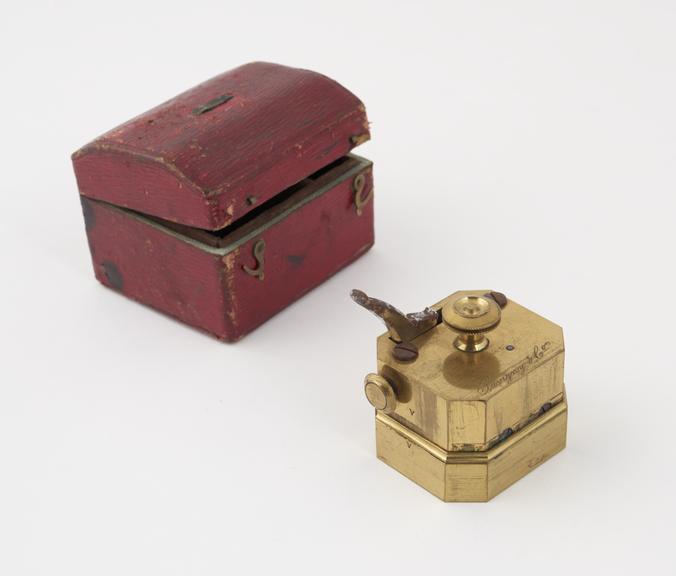 Brass scarificator, with 12 lancets, in case, by Savigny and Co