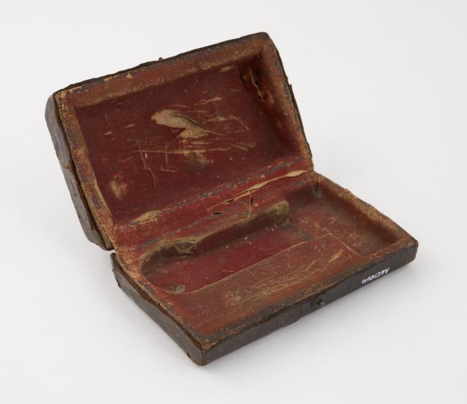 Leather covered case for automatic lancet, possibly veterinary