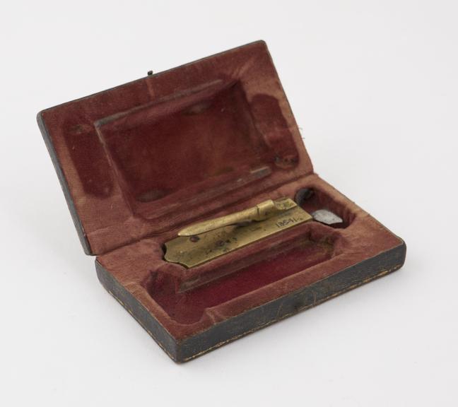 Brass automatic lancet, in leather covered case