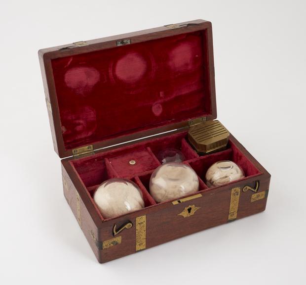 Set of cupping instruments in wooden box