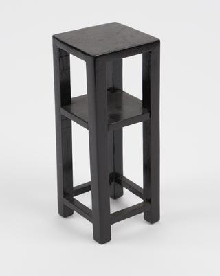 Tall black shelves for model of Chinese pharmacy