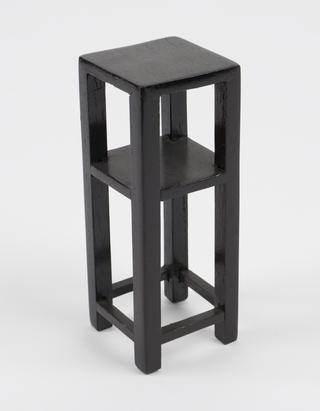 Tall black shelves for model of Chinese pharmacy