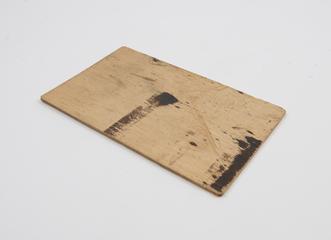 Wooden slide, with black ink staining