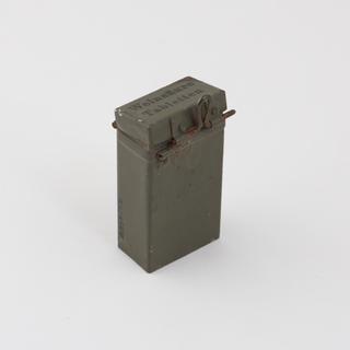 Rectangular tin with hinged lid containing sour wine tablets