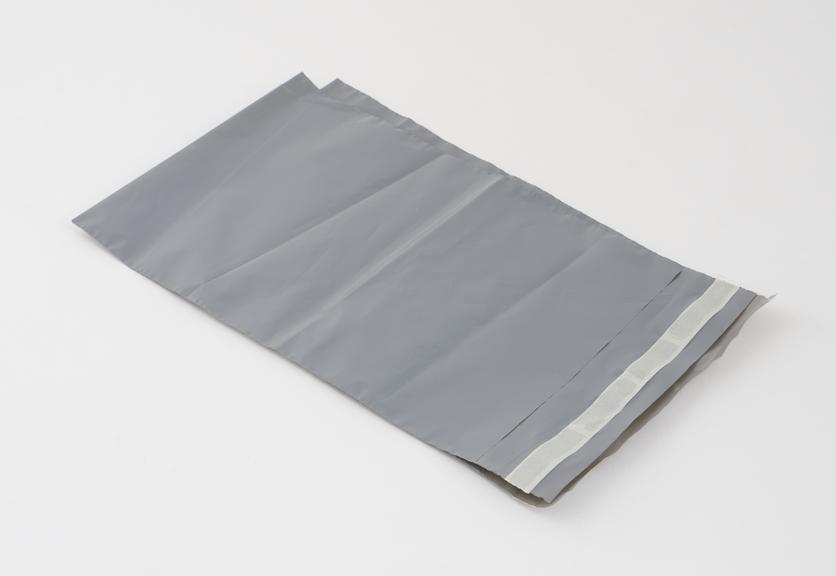 2 grey plastic disposal bags, sealable