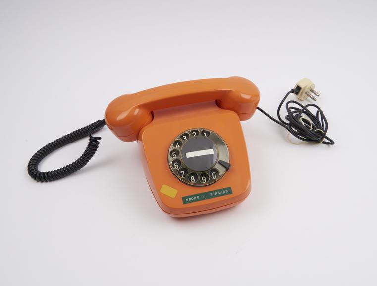 Telephone handset, dial, orange, model 'Berlin' made by Krone