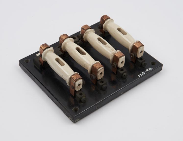 Bank of four tubular fuses