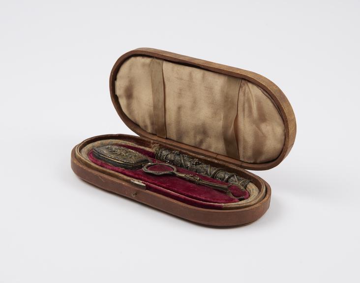 Tinder-box (length 6 3/4 ins) containing flint, steel