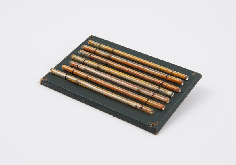 Seven Ethereal Matches, mounted on a board