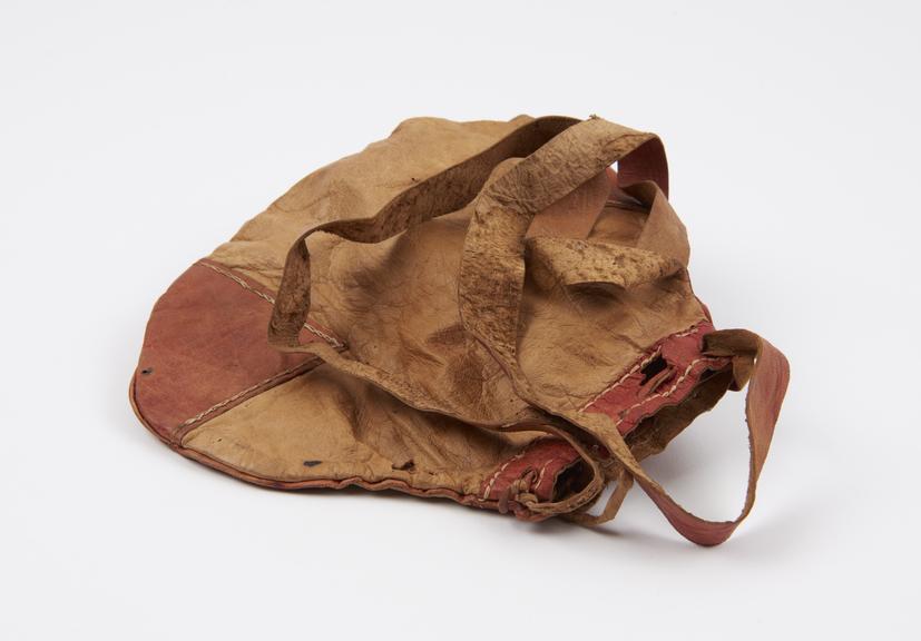 Tinder-pouch (breadth 7 1/2 ins) of buff leather