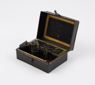 Instantaneous Light Box of thin iron; rectangular (size 5 1/4 x 3 3/4 x 2 1/4 ins)