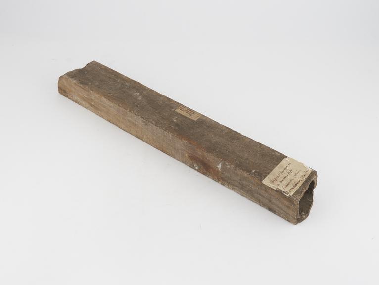 Wooden pipe containing concret