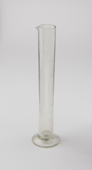 Glass measuring cylinder from the laboratory at Grimshaw Brothers & Sons Chemical Works in Clayton