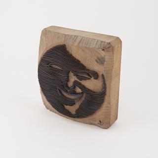 Face plate stamp with a smiling Moon face design made by J. Harvey of Dundee and used by Stavert