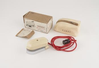 Portable iron in box.