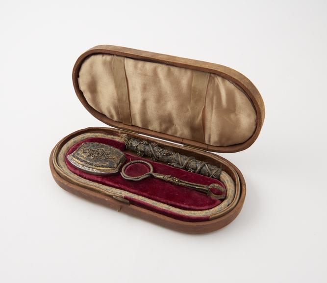 Tinder-box (length 6 3/4 ins) containing flint, steel