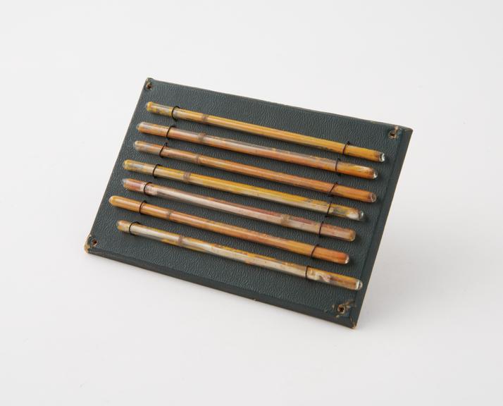 Seven Ethereal Matches, mounted on a board