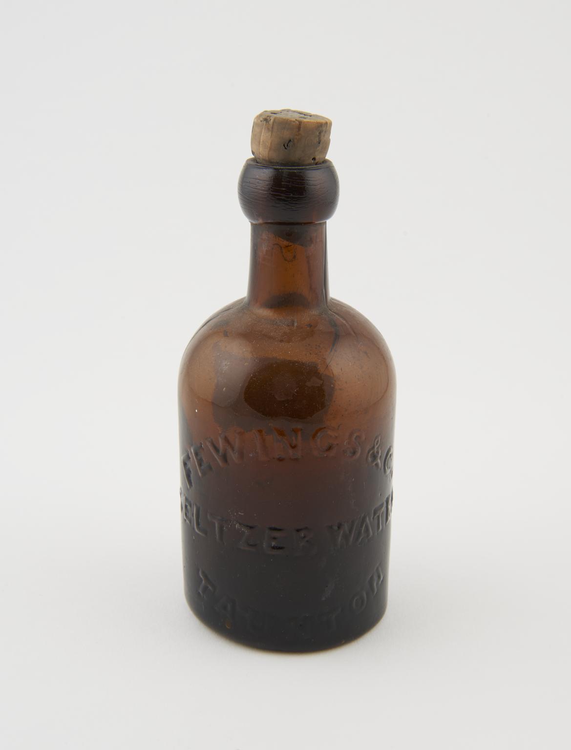 One of two early glass bottles