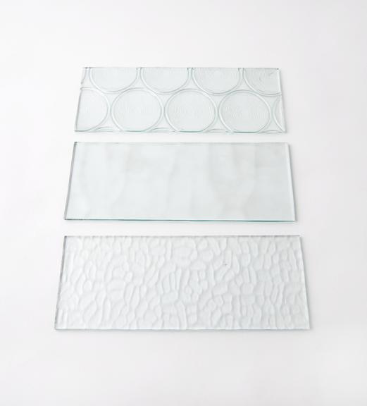 Three of eight pieces of figured glass (white)