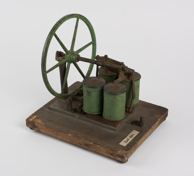 Electric motor mounted on a wooden base