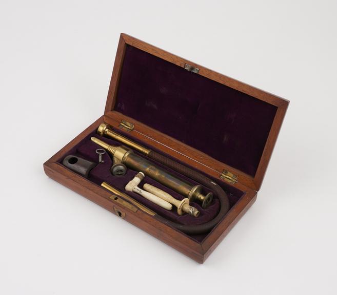 Enema syringe set in wooden case