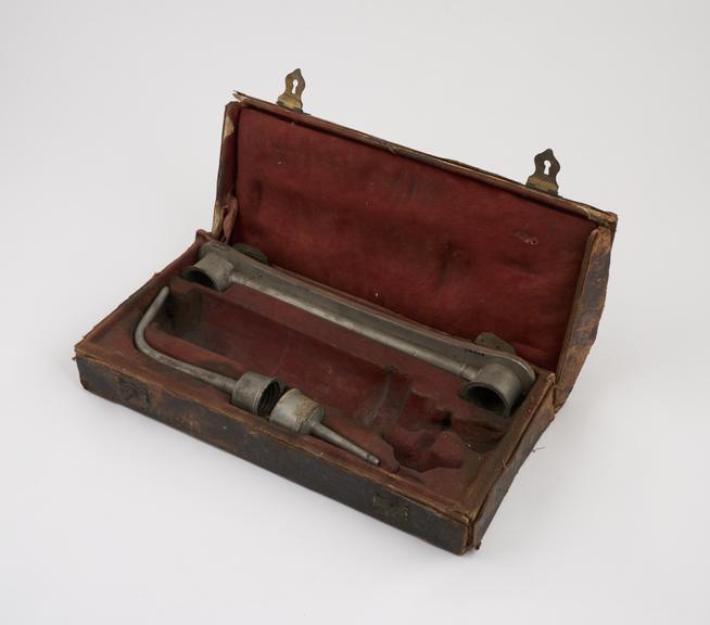Parts of an enema syringe, cased
