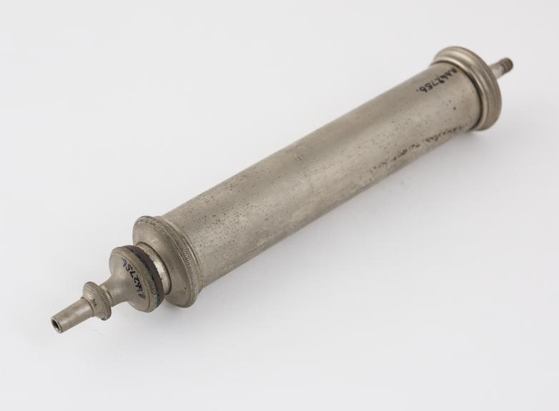 Metal piston-action syringe