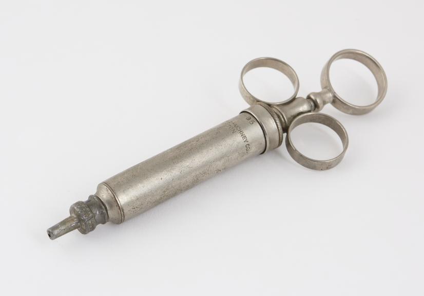 Metal piston-action syringe, by the Randall-Faichney Co