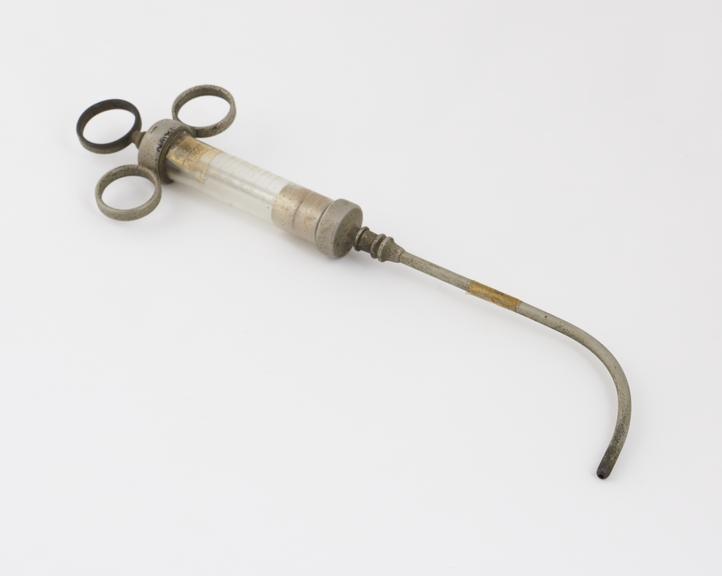 Syringe with curving pipe attachment, owned by Dr