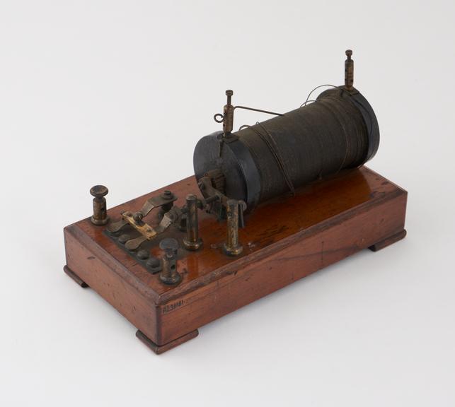 Induction coil mounted on wooden base with trembler