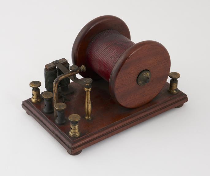 Bobbin-type induction coil mounted on mahogany base with