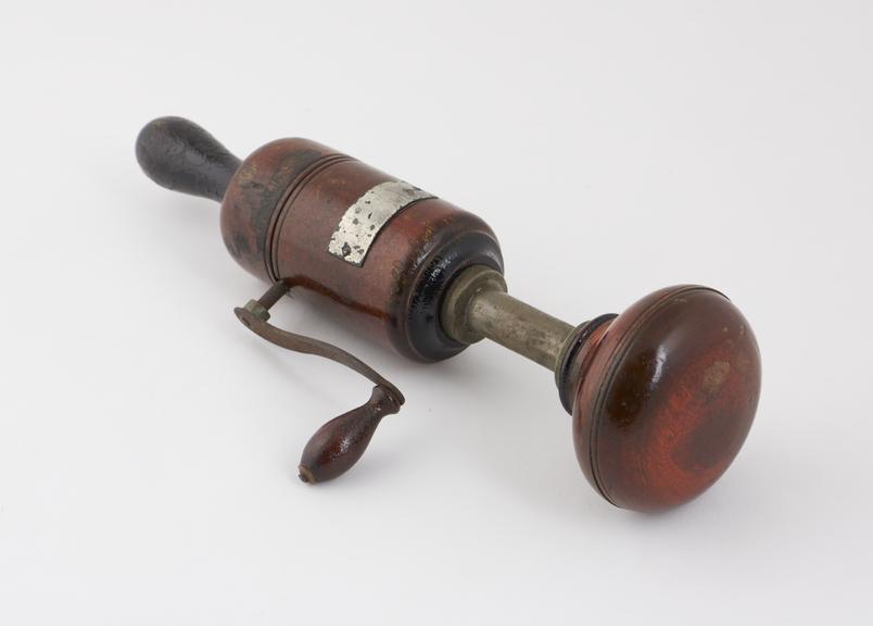 Vibrator, operated by cranking a handle, late 19th century