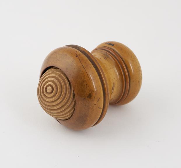 Wooden masseur roller consisting of freely rotating grooved