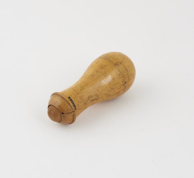 Wooden masseur roller consisting of freely rotating grooved