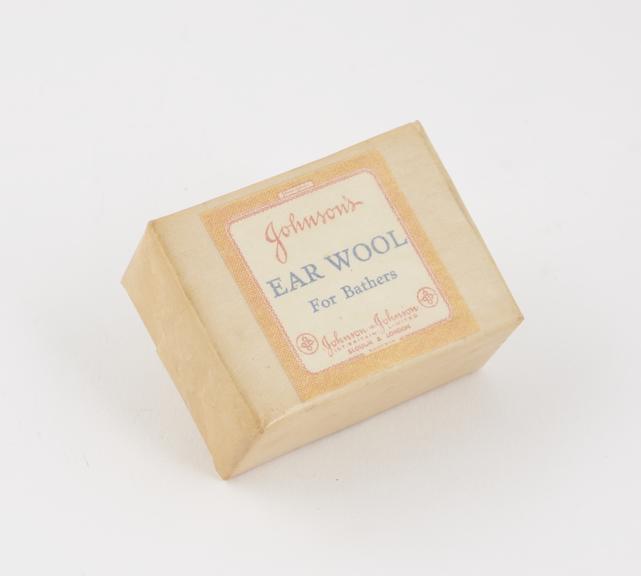 One small packet containing ear wool for bathers by Johnson and