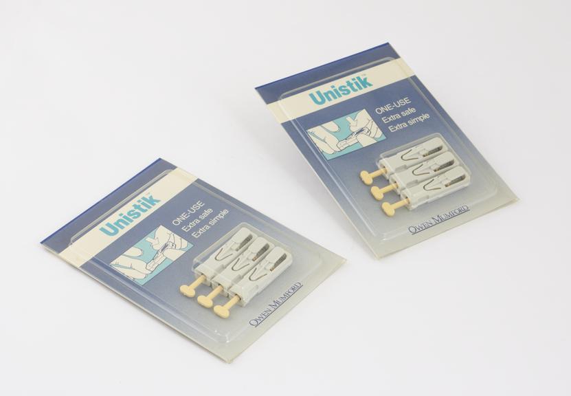 Two packets of Unistik 2 single-use disposable finger-pricking