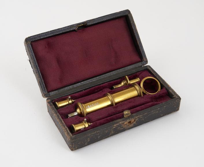 Syringe and needles, brass, in leather case, 19th century