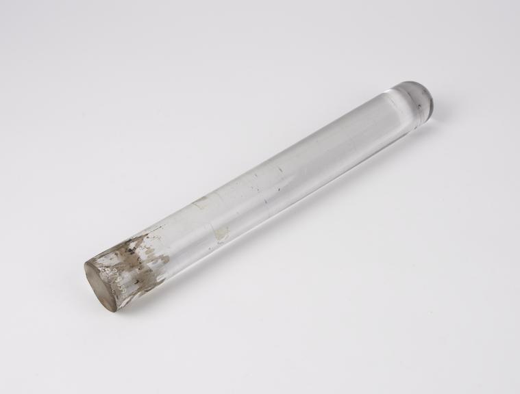 Solid glass stool leg from a piece of experimental apparatus