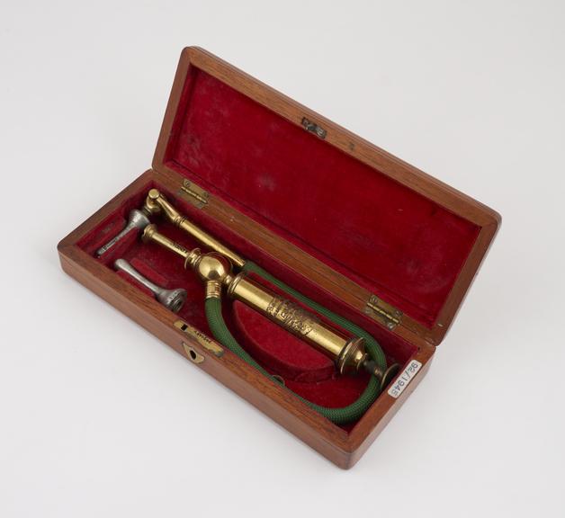 Enema set, with piston action syringe