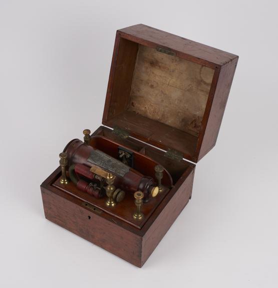 Grigg's electromagnetic machine mounted in box with room for 2