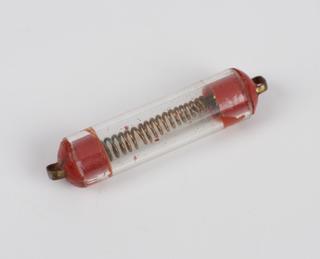 Coil of wire inside a glass tube with red painted ends