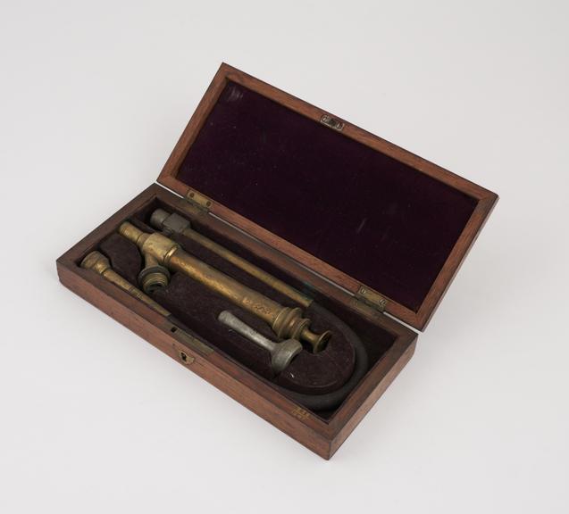 Enema set, to Read's patent, with syringe, tube, and nozzle