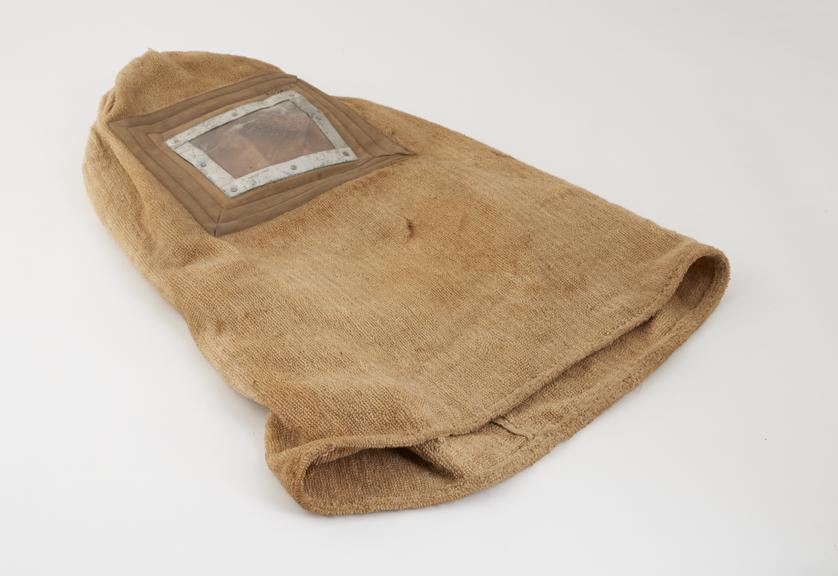 Smoke helmet, cloth towelling with face-piece of mica and metal