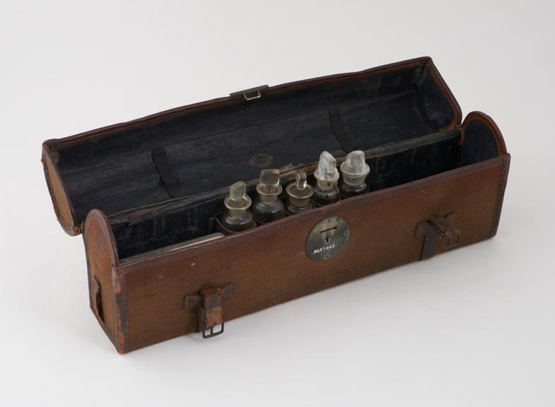 Portable medical bag made of brown canvas, leather bound